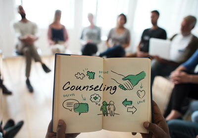 counselling book with group in background