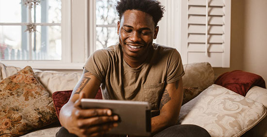 black man using tablet