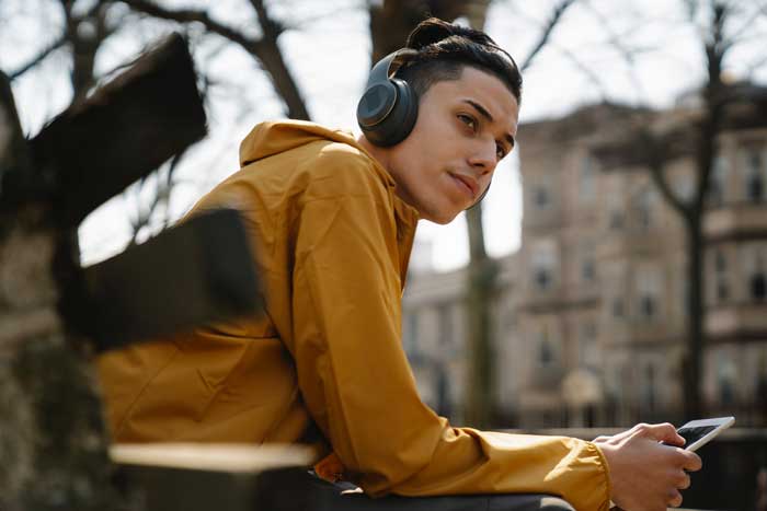 teen boy headphones and ipad